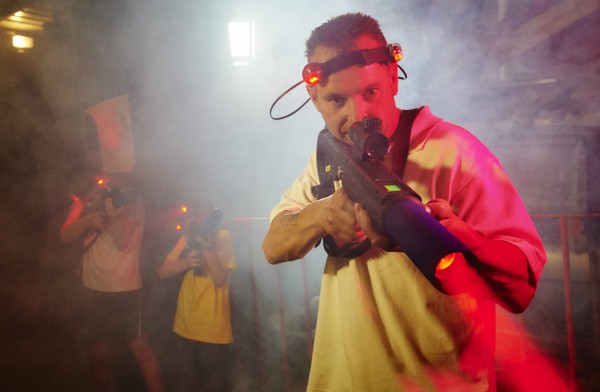 adult playing laser tag